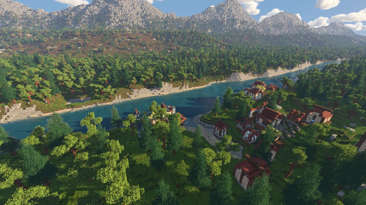 Godot development capture of a wooded voxel river valley with a village in the foreground and mountains beyond